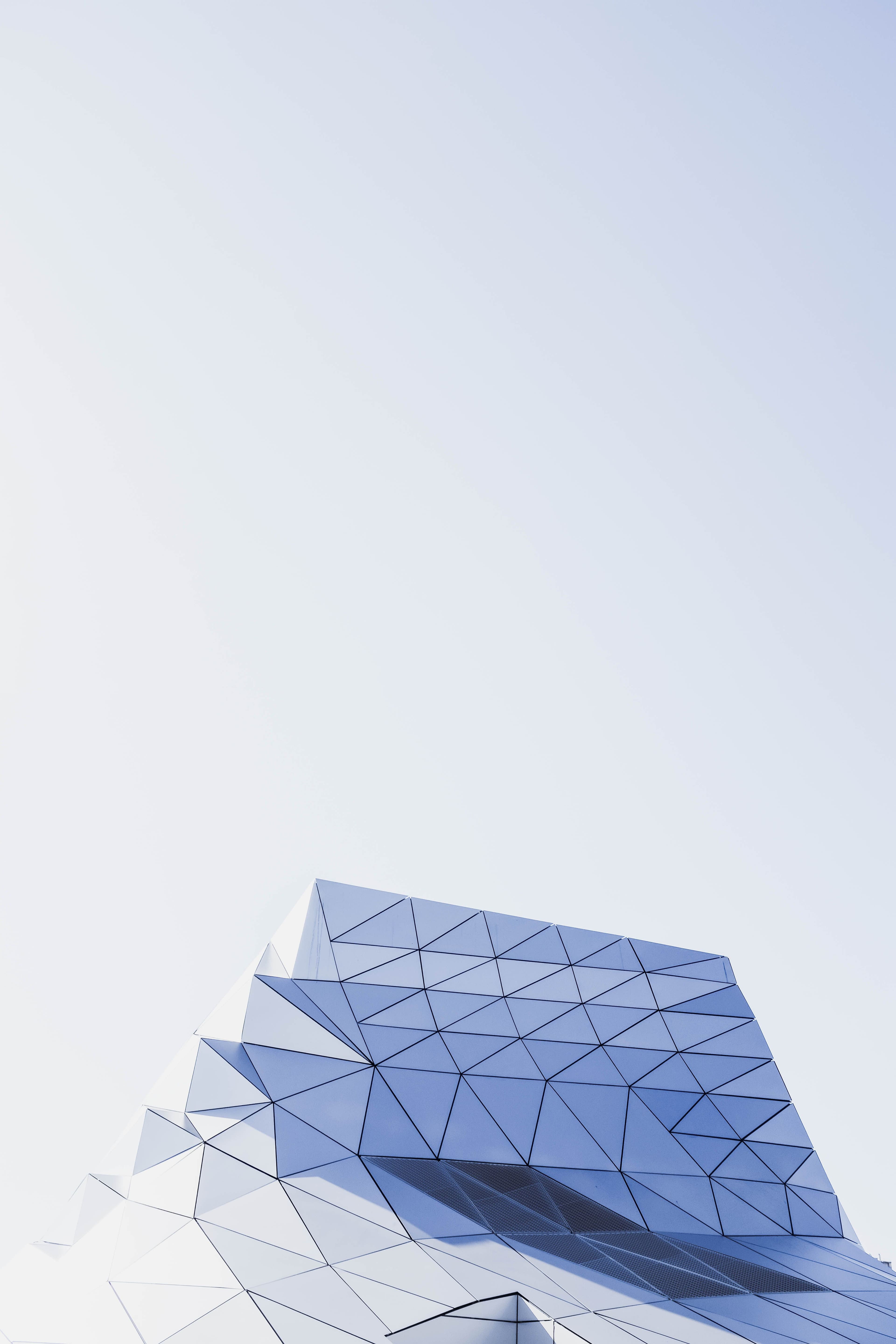 Angular facade against a pale sky